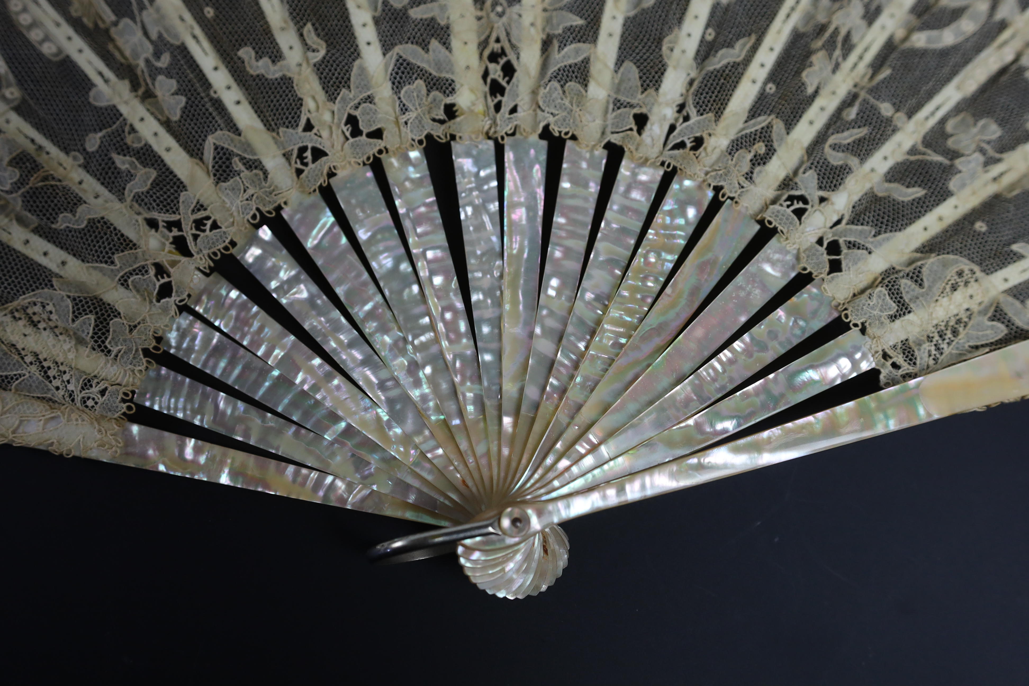 An unusual commemorative Carrickmacross lace fan, possibly one made and entered for a group of competitions held by the Worshipful Company of Fan Makers, the winning fan to be presented to Queen Victoria as a gift for he